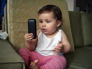 Cute child talking on cellphone.