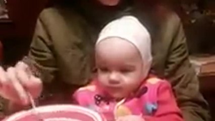 Hungry baby keeps trying to steal mom's food