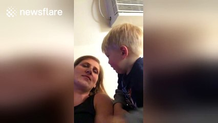 Toddler tries to wake up mum with kisses