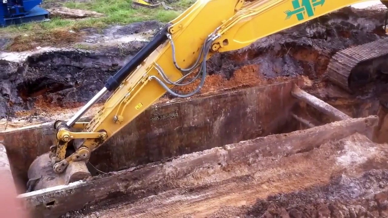 Caterpillar 336E excavator digging for storm pipe