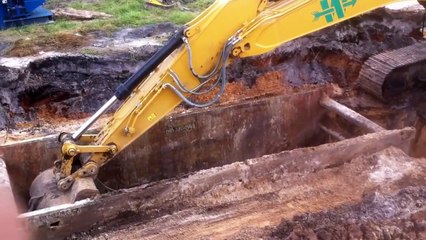 Caterpillar 336E excavator digging for storm pipe