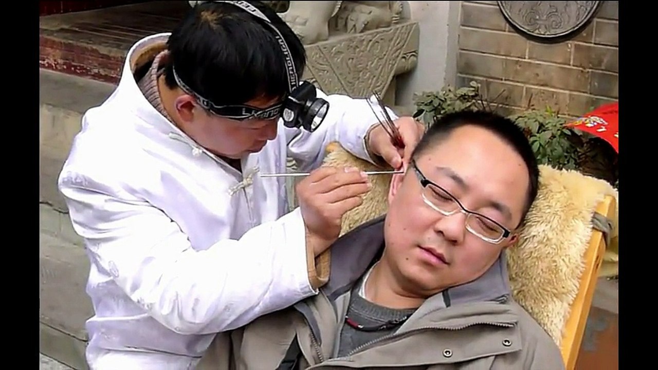 Chinese Ear Cleaning (52) A man enjoying a relaxing ear cleaning session