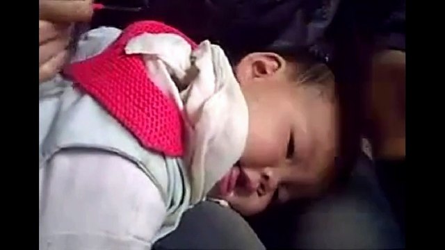 Chinese Ear Cleaning (70) A mother cleaning her daughter's ears