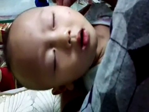 Chinese Ear Cleaning (77) A baby enjoying his ear cleaning session