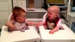 Twin babies engage in hysterical giggling fit