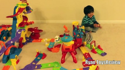Kid playing with toys Vtech Go Go smart wheels review amazement park train station