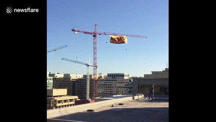 Activists unfurl anti-Donald Trump RESIST banner from crane in Washington DC