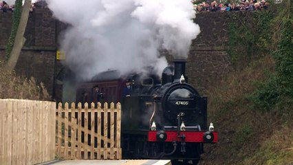 Prince Charles tries his hand at driving a steam train