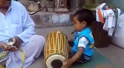 God gift - small kid playing dholak