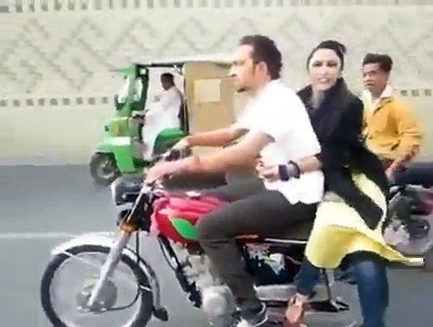 Pakistani Boy With A Girl Doing One Wheeling On Bike - Video