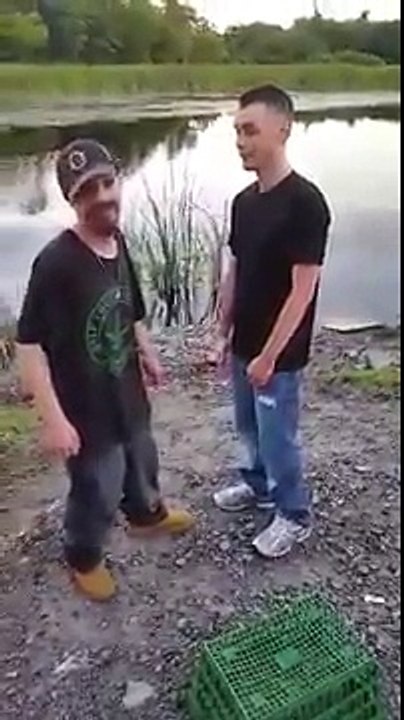 Funny video of two drunk guys fighting next to a lake