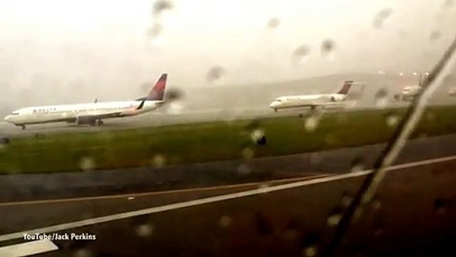 Shocking moment lightning bolt strikes plane on runway