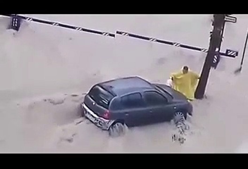 Horrific moment a helpless man was swept into the sea by a storm