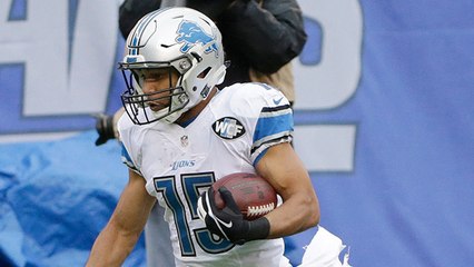 Golden Tate hangs on after big hit for 24 yards