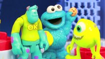 Cookie Monster visits MONSTERS INC & Scare Floor Mike Sully Disney Ariel Frozen Elsa AllToyCollector
