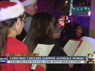 Woman surprised with Christmas carolers in Avondale