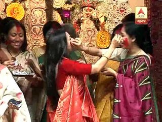 Koel  Mullick performing sindur khela with others.