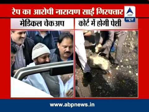 Narayan Sai smiles, waves to supporters as cops take him for medical tests