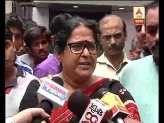 Pratima Dutta  stands beside dr. Biswas at Hospital