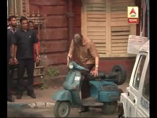 Amitabh Bachchan kickstarts a scooter while shooting in Kolkata