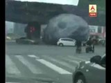 Giant Moon Balloon Rolls Through Traffic in China
