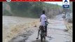 Biker washed away into river while crossing a flooded bridge