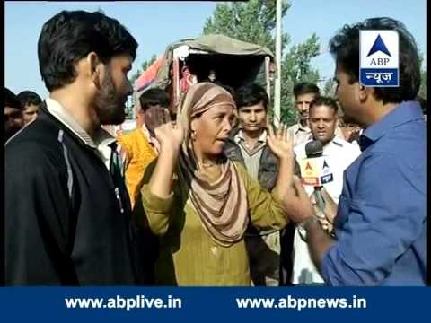 Trucks turn into homes as people wait for water to leave their homes in Srinagar's Lasjan area