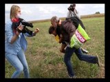 SHOCKING VIDEO: Female photographer kicks a migrant to get her exclusive shot, sacked