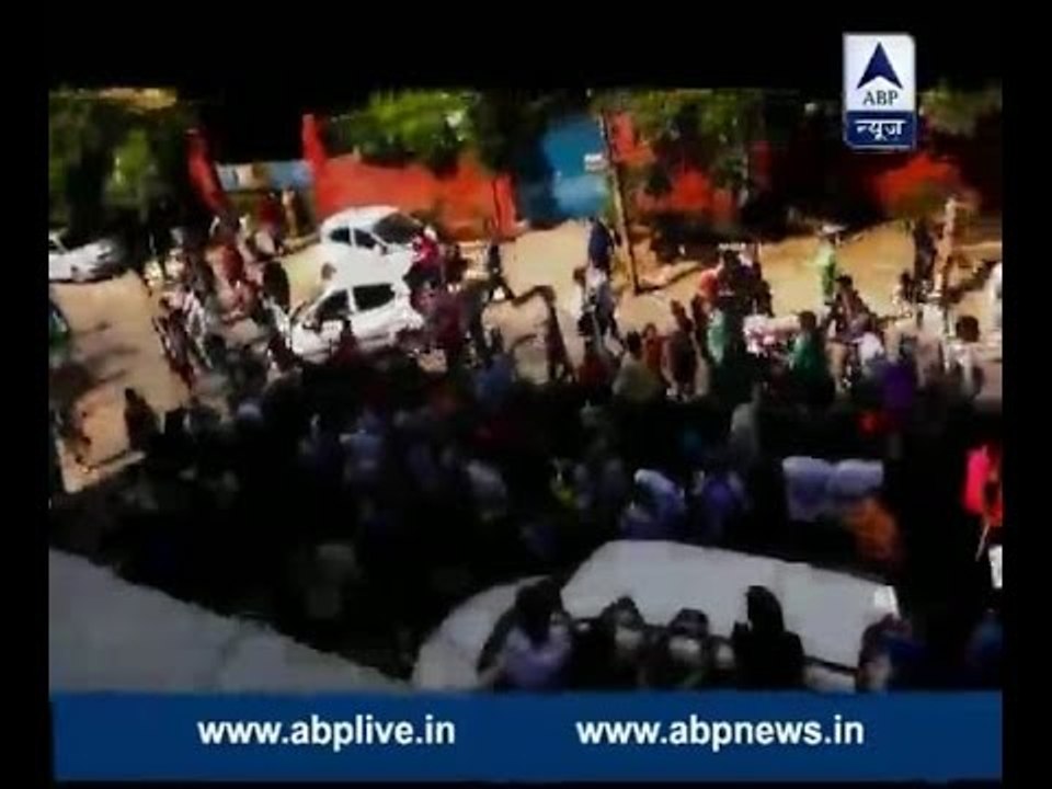 People protest against pulling down a 40-year-old temple in Delhi's Lakshmi Nagar area
