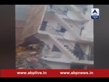 Delhi: Building demolished after it suffered cracks in the recent earthquake