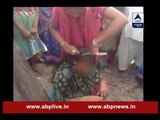 Sansani: Wife shaves head of her husband and his girlfriend infront of everyone for cheati