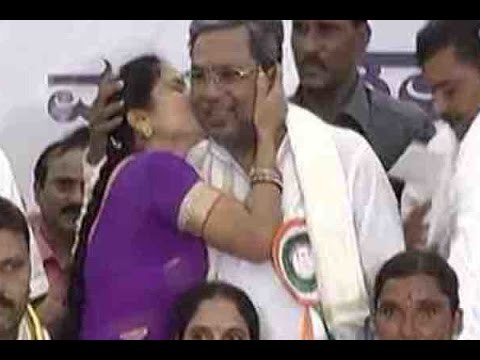 Woman kisses Karnataka CM Siddaramaiah at a public event