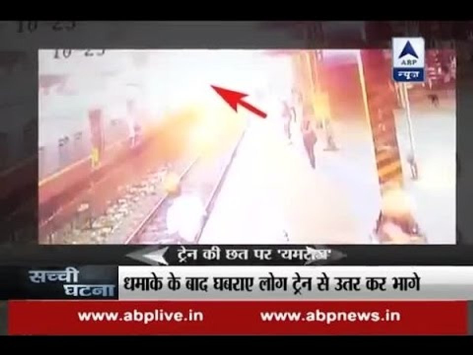 Watch man getting entangled in high tension wires post travelling on train roof