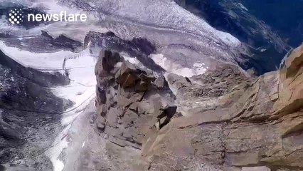 Man flies really low over Alpine glacier in wingsuit