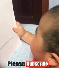 Video lucu TATAN ketika mencoba belajar baca yang ada di kertas yang di pegang nya