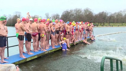 Swimmers brave elements for festive Serpentine dip