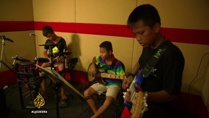 Teaching music to kids in Bangkok's slums