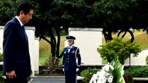 Japan's Abe pays respects at Hawaii memorials a day before Pearl Harbor trip