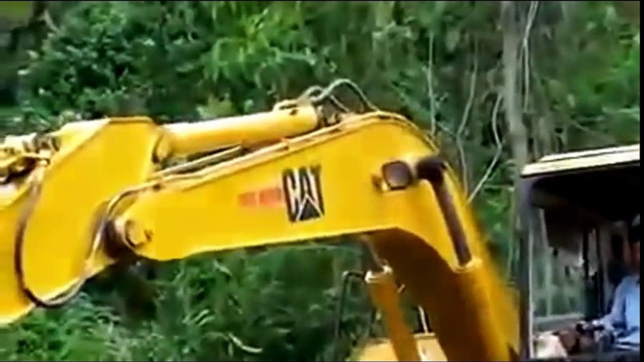 Heavy equipment monster machines tractor, excavator , truck working in mud