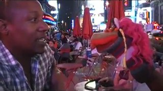 Over My Head My Head Gospel Song sung by Anthony McGlaun with Wee Bee Worlds Kid's puppet Peggy in Times Square in New York City