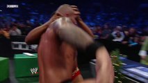 Randy Orton takes a moment to eat Christmas cookies during a match -