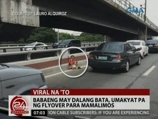 24 Oras: Babaeng may dalang bata, umakyat pa ng flyover para mamalimos