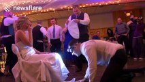 Groom looks for bride's garter with head torch