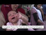 Hungarian police tear gas at protesting refugess