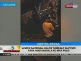 Suspek sa droga, halos yumakap sa poste para hindi madala ng mga pulis