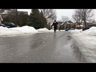 Man Skates on Frozen Toronto Street