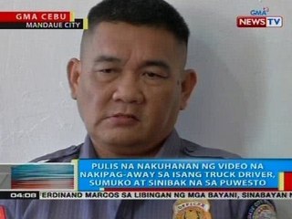 Pulis na nakuhaan ng video na nakipag-away sa isang truck driver, sumuko at sinibak na sa puwesto