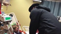 Cam Newton visits young fan in hospital