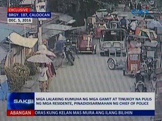 Saksi: Mga lalaking kumuha ng mga gamit at tinukot na pulis ng mga residente, pinadidisarmahan