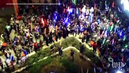Stunning lightsaber vigils honor Princess Leia